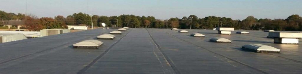 Expansion seam repair over a roof to roof joints creating a seamless transition.